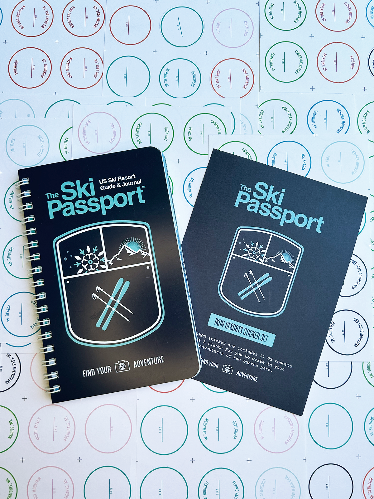 The Ski Passport journal and the ikon resort sticker set with ski resort stickers in the background