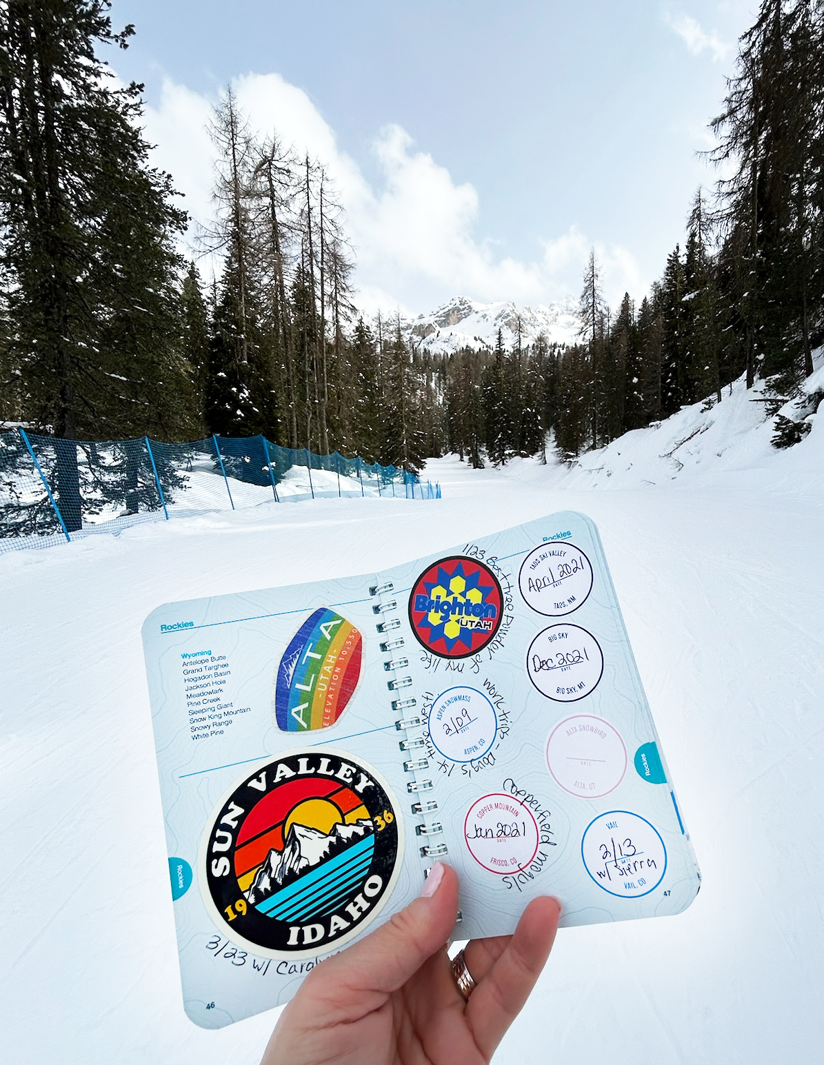 Ski Passport Journal Booklet sticker page preview with snowy mountains in the background