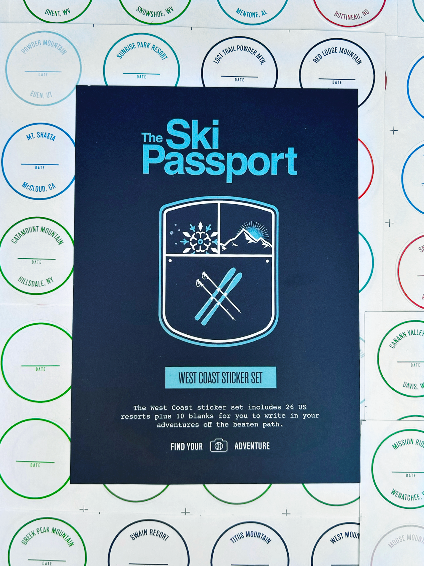 The Ski Passport West Coast ski resort sticker set with ski resort stickers in the background